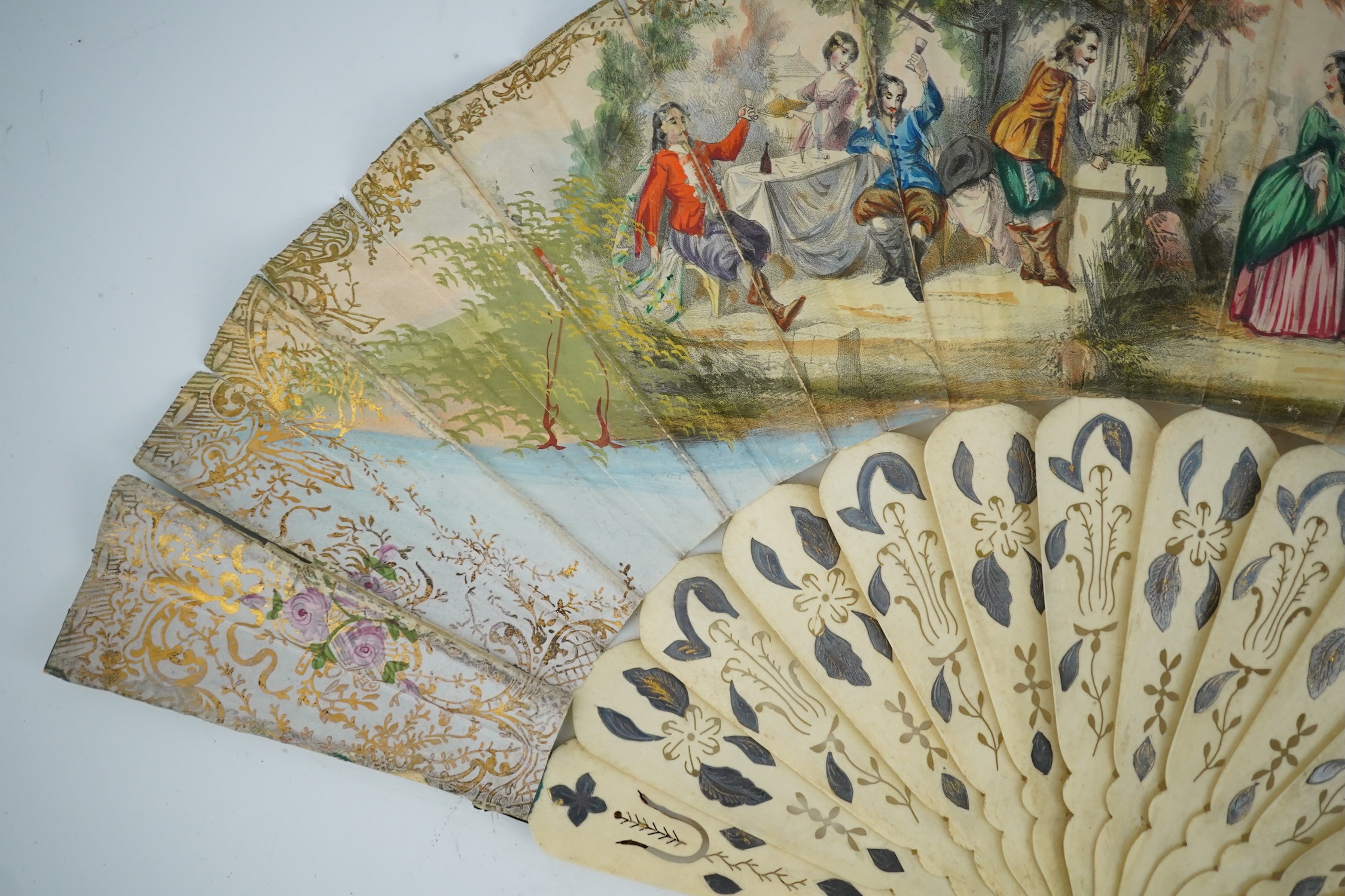 Three French fans: a mother of pearl and sequin fan boxed, a painted silk, feather and bone fan and a gilt decorated bone figural paper fan, the two bone fans having gilt mirrored mounts on the guards, figural paper fan